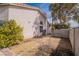 View of the side of the home showing block wall, and desert landscaping at 3125 Cristobal Way, Las Vegas, NV 89117