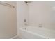A bathtub with white tile surround, a shower head, and a towel bar at 3125 Cristobal Way, Las Vegas, NV 89117