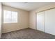 Bedroom with neutral walls, carpet, and closet for storage at 3125 Cristobal Way, Las Vegas, NV 89117