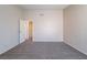Bedroom with neutral walls, carpet, and view of entryway at 3125 Cristobal Way, Las Vegas, NV 89117