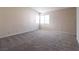Large room with carpet, neutral walls, and corner window view at 3125 Cristobal Way, Las Vegas, NV 89117