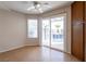 Bedroom with wood floors, ceiling fan, backyard pool view, and closet storage at 3125 Cristobal Way, Las Vegas, NV 89117