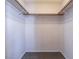 A walk-in closet with carpeted floor and simple hanging rods for organized storage at 3125 Cristobal Way, Las Vegas, NV 89117