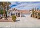 Charming single-story home featuring a terracotta tile roof and a well-manicured front yard at 3125 Cristobal Way, Las Vegas, NV 89117