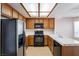 Functional kitchen with black appliances, and light-colored cabinets at 3125 Cristobal Way, Las Vegas, NV 89117