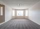 Spacious living room with large windows and neutral carpet at 3125 Cristobal Way, Las Vegas, NV 89117