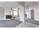 Inviting living space featuring plush neutral carpet and a cozy fireplace at 3125 Cristobal Way, Las Vegas, NV 89117