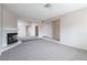 Expansive living room featuring a fireplace and easy access to other rooms at 3125 Cristobal Way, Las Vegas, NV 89117