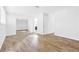 Large bedroom with wood-look floors, natural light, and closet at 3547 Rosewood St, Las Vegas, NV 89103