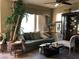 Inviting living room with a comfortable couch, tile floors, and decorative accents at 3601 Pinnate Dr, Las Vegas, NV 89147