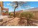 Private backyard with desert landscaping and covered patio provides a relaxing outdoor space at 3603 Herring Gull Ln, North Las Vegas, NV 89084