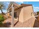 Backyard featuring a pergola-covered patio, paving stones and low-maintenance landscaping at 3603 Herring Gull Ln, North Las Vegas, NV 89084