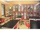 Bright classroom with individual desks, chairs, and wall storage for supplies and learning resources at 3603 Herring Gull Ln, North Las Vegas, NV 89084