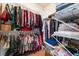 Organized walk-in closet with shelves and hanging racks for clothes and accessories providing ample storage at 3603 Herring Gull Ln, North Las Vegas, NV 89084