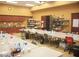 Well-lit craft room with tables, chairs, storage, sink, and supplies, perfect for creative projects at 3603 Herring Gull Ln, North Las Vegas, NV 89084