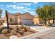 Inviting single-story home with a well-kept yard and attached two-car garage at 3603 Herring Gull Ln, North Las Vegas, NV 89084