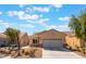 Charming single-story home with well-maintained front yard, desert landscaping, and a two-car garage at 3603 Herring Gull Ln, North Las Vegas, NV 89084