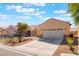 Attractive single-story home with a two-car garage, desert landscaping and stone accents at 3603 Herring Gull Ln, North Las Vegas, NV 89084