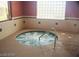 A luxurious indoor hot tub with clear blue water, offering a relaxing and private spa-like experience at 3603 Herring Gull Ln, North Las Vegas, NV 89084
