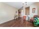 Inviting living room with wood floors, neutral walls, and decorative chandelier at 3603 Herring Gull Ln, North Las Vegas, NV 89084