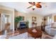 Open-concept living area with wood floors, neutral decor, and easy flow to other rooms at 3603 Herring Gull Ln, North Las Vegas, NV 89084