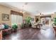 Spacious living room with wood floors, large windows, and access to outdoor patio at 3603 Herring Gull Ln, North Las Vegas, NV 89084