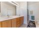 Bathroom with double sink vanity and a glass-enclosed shower at 3608 Herring Gull Ln, North Las Vegas, NV 89084