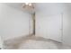 A bedroom with a ceiling fan and a closet with white sliding doors at 3608 Herring Gull Ln, North Las Vegas, NV 89084