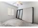 Empty bedroom featuring a large window and neutral carpet at 3608 Herring Gull Ln, North Las Vegas, NV 89084