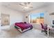 Bright bedroom featuring a large window and neutral carpet at 3608 Herring Gull Ln, North Las Vegas, NV 89084