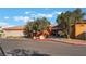 View of the community entrance with mature trees and desert landscaping elements at 3608 Herring Gull Ln, North Las Vegas, NV 89084