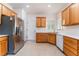 Efficient kitchen featuring stainless steel refrigerator and ample cabinet space; practical and tidy at 3608 Herring Gull Ln, North Las Vegas, NV 89084
