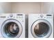 Close up of white front-loading washer and dryer at 3608 Herring Gull Ln, North Las Vegas, NV 89084