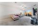 Bright living room with plush carpet and access to the patio; perfect for relaxation and entertainment at 3608 Herring Gull Ln, North Las Vegas, NV 89084