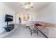 Spacious living room with open layout, modern entertainment center, and a view into the kitchen area at 3608 Herring Gull Ln, North Las Vegas, NV 89084