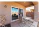 Outdoor patio featuring seating area with table and chairs and sliding glass door at 3608 Herring Gull Ln, North Las Vegas, NV 89084
