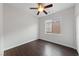 Cozy bedroom featuring hardwood floors, neutral walls, and a window view at 3718 True Spring Pl, North Las Vegas, NV 89032