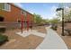 Outdoor fitness area featuring exercise bars, mature trees, and inviting sidewalks at 3718 True Spring Pl, North Las Vegas, NV 89032