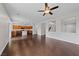 Open living space blending the kitchen, living room, and staircase with hardwood floors at 3718 True Spring Pl, North Las Vegas, NV 89032