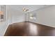 Bright and spacious living room with hardwood floors, white walls, and a ceiling fan at 3718 True Spring Pl, North Las Vegas, NV 89032