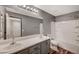 Modern bathroom with double sinks, updated fixtures, and a shower-tub combo at 4225 Ponce Royal Ave, North Las Vegas, NV 89031