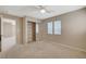 Cozy carpeted bedroom showcasing a mirrored closet and two bright windows at 4225 Ponce Royal Ave, North Las Vegas, NV 89031