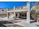 Exterior of home with covered patio and upper level balcony at 4225 Ponce Royal Ave, North Las Vegas, NV 89031