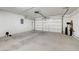 Spacious two-car garage with white walls and ample room for storage at 4225 Ponce Royal Ave, North Las Vegas, NV 89031