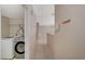 Hallway featuring a laundry area with modern washer and dryer units at 4225 Ponce Royal Ave, North Las Vegas, NV 89031