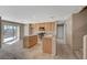 Bright kitchen boasts stainless steel appliances, granite countertops, and access to the backyard through sliding glass doors at 4225 Ponce Royal Ave, North Las Vegas, NV 89031