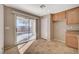 Bright kitchen featuring tile flooring, cabinetry, and sliding glass doors to the backyard at 4225 Ponce Royal Ave, North Las Vegas, NV 89031