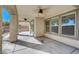 Spacious covered patio with ceiling fans and access to backyard at 4225 Ponce Royal Ave, North Las Vegas, NV 89031