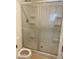 Bathroom featuring a glass enclosed shower with built-in shelves at 4236 Thomas Patrick Ave, North Las Vegas, NV 89032