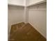 Spacious walk in closet providing ample shelving for organization of clothes and accessories at 4236 Thomas Patrick Ave, North Las Vegas, NV 89032